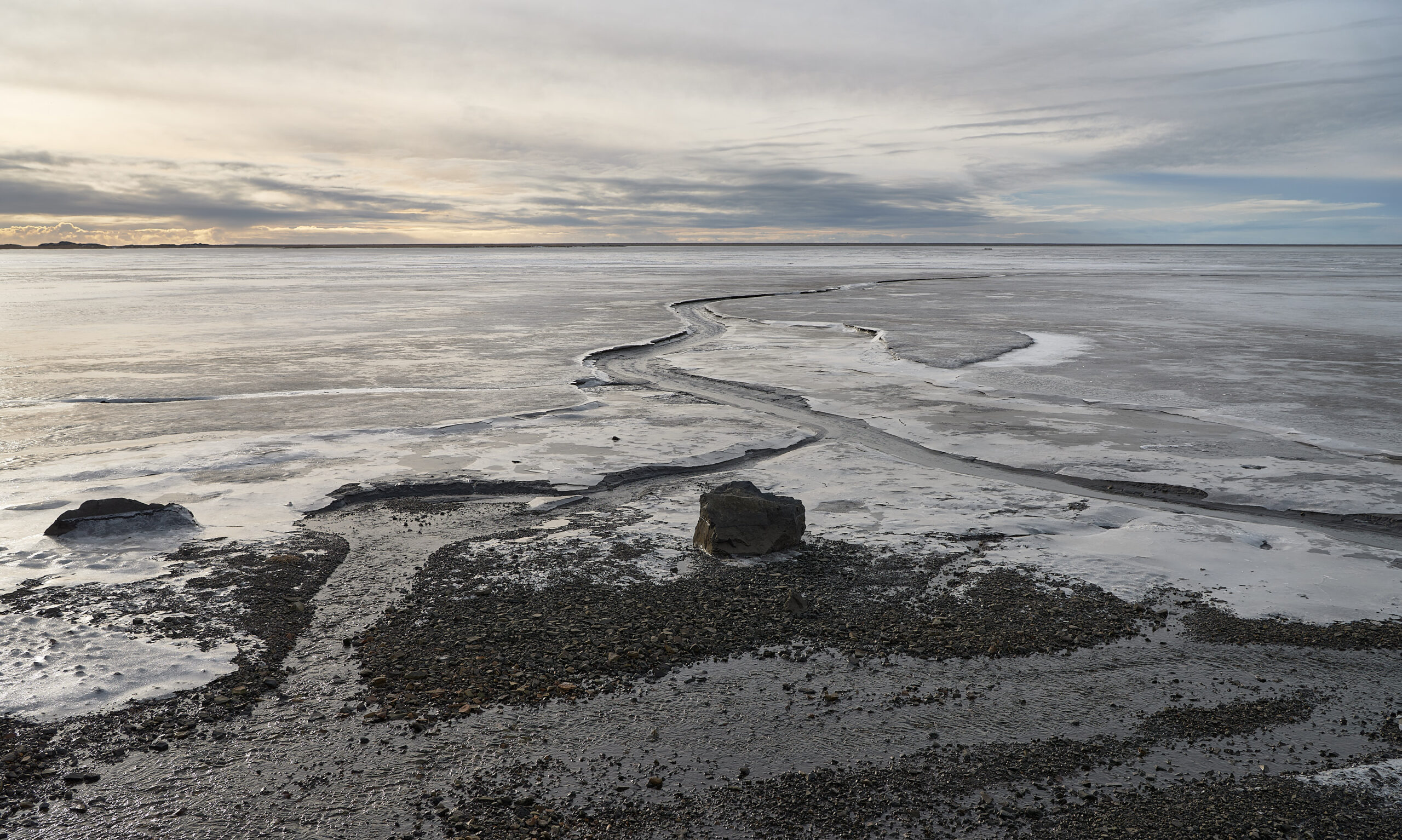 View of the bay Skarðsfjörður behind the Austurfjörur spit east of Höfn near the Stokksnes headland below the famous Vestrahorn mountain on the south coast of Iceland.