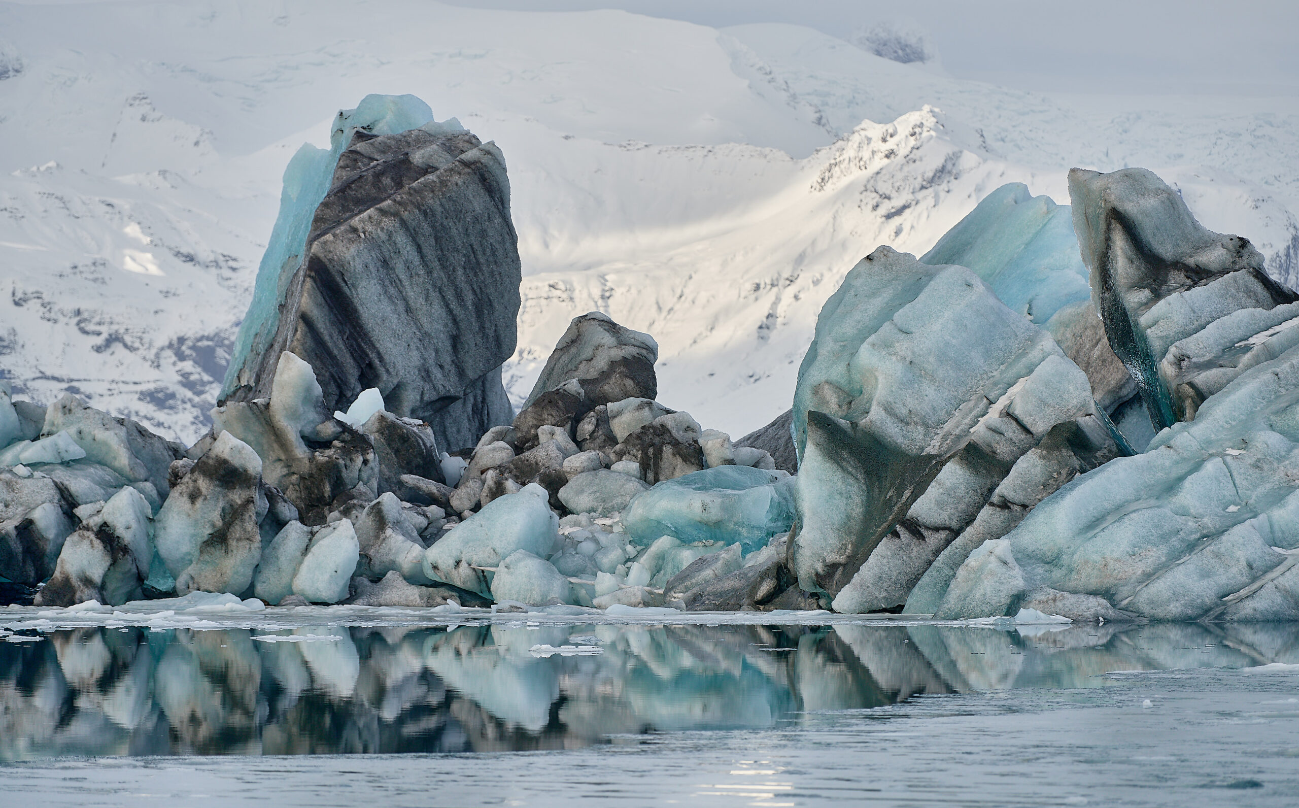 The glacial ice of Vatnajökull, colored by volcanic ash, in the Jökulsárlón glacier lagoon in Iceland.