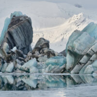 The glacial ice of Vatnajökull, colored by volcanic ash, in the Jökulsárlón glacier lagoon in Iceland.
